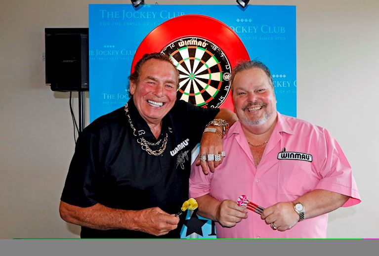 RACEGOERS HAVE THE CHANCE TOMORROW TO TEST THEIR DARTS SKILLS AGAINST STARS OF THE OCHE MANLEY AND G